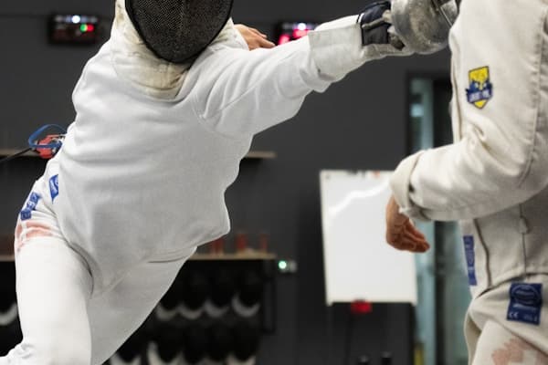 Two fencers in competitive bout